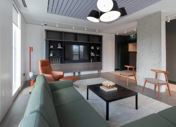 a living room with a couch and a coffee table and a television