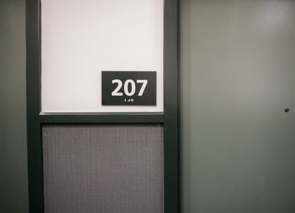 a door with a sign that says 207 on it