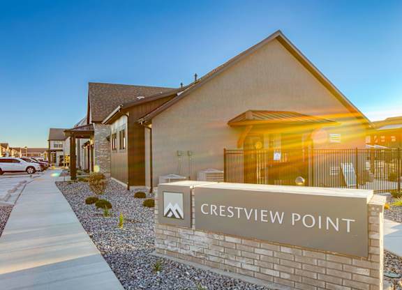 Crestview Point is a residential area with houses and a clear sky.