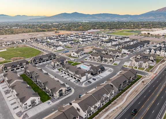 A suburban neighborhood with houses and a road.