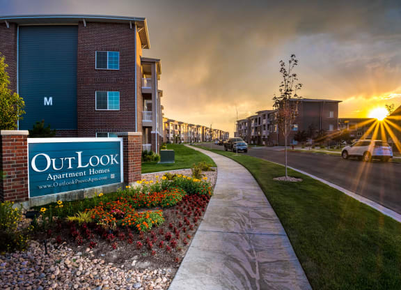 a walkway during sunset along a building at Outlook Apartments for rent in Springville, and Provo Utah.