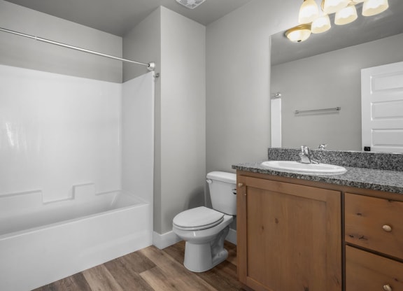 a bathroom with a sink toilet and a bath tub