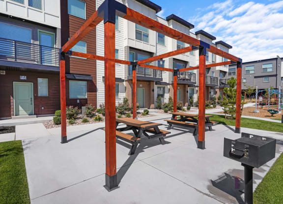 our apartments have a spacious patio with picnic tables and a grill