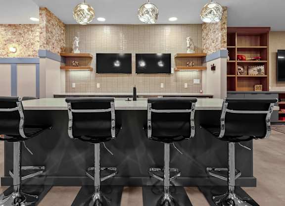 A conference room with a long table and chairs.
