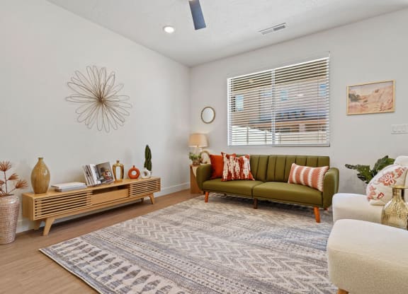 a living room with a couch and a window