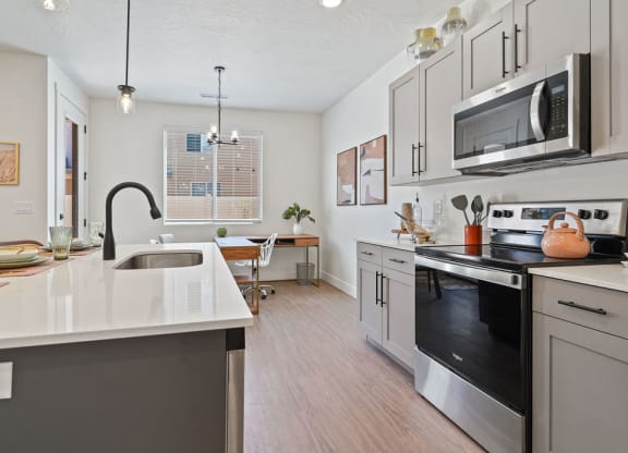 a kitchen with a sink and a microwave