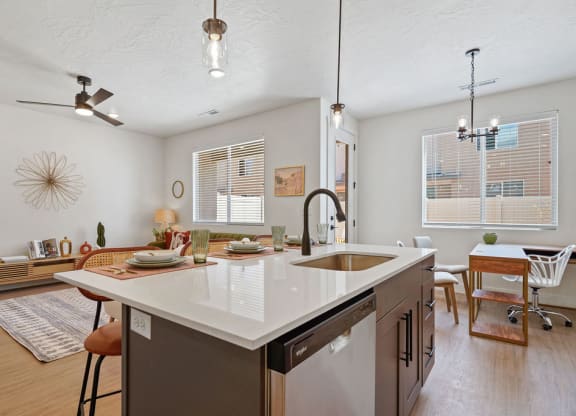 a kitchen with a large island in the middle of it