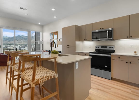 a furnished kitchen with stools