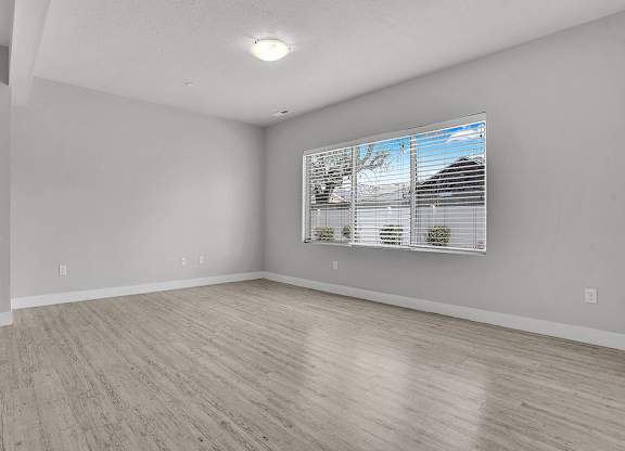 A room with a window and a door.