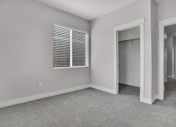 A room with a window and a door.