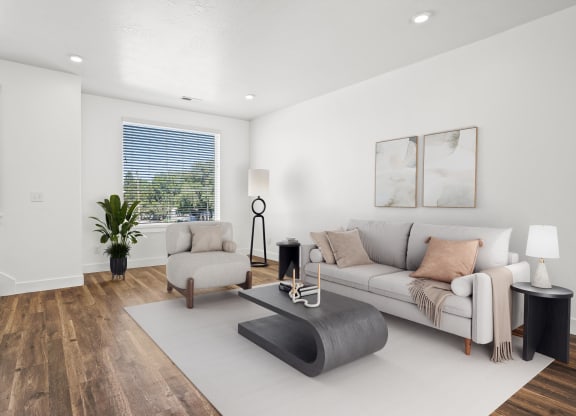 a living room with a couch and a chair at Aero Luxury Townhomes in Layton, UT