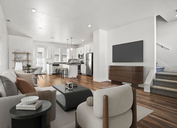a living room with a couch and a table  at Aero Luxury Townhomes in Layton, Utah