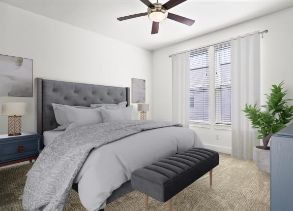 a bedroom with a bed and a ceiling fan at Aero Luxury Townhomes in Layton, Utah