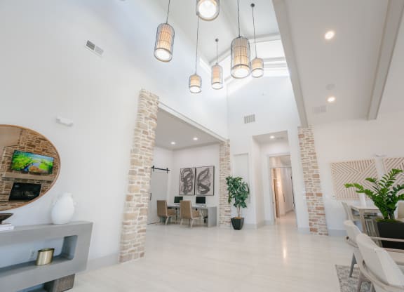 a living room and dining room with white walls and white floors at Aldara Apartments in Saratoga Springs, Utah