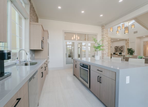 a large kitchen with a sink and a counter top at Aldara Apartments in Saratoga Springs, Utah