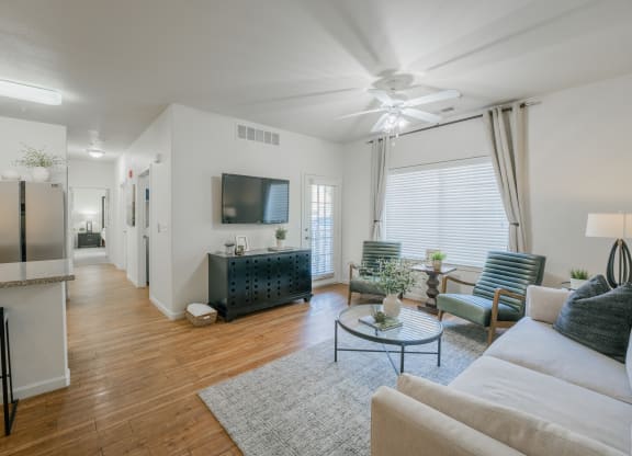 a living room with a couch and a coffee table at Aldara Apartments in Saratoga Springs, Utah