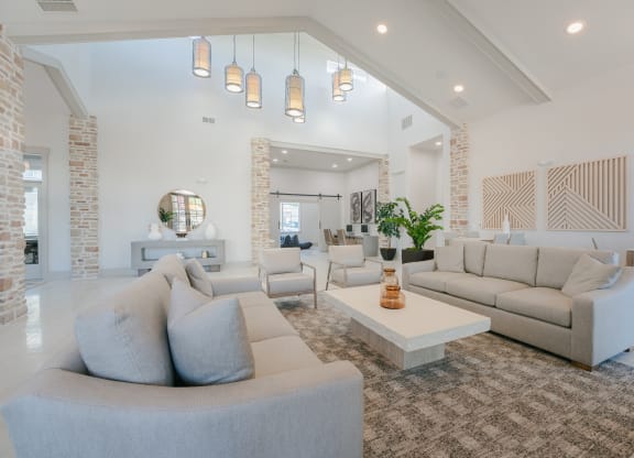 a living room with couches and chairs and a coffee table at Aldara Apartments in Saratoga Springs, Utah