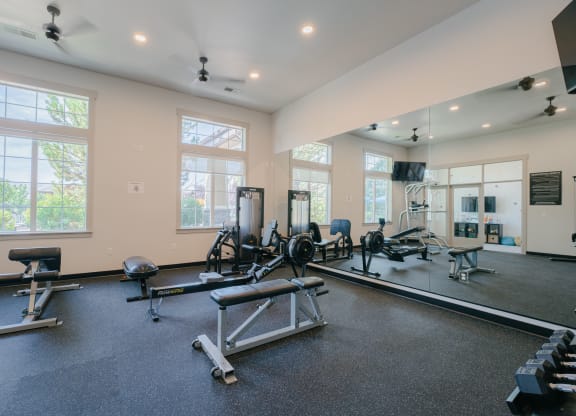 the gym with treadmills and weights at at Aldara Apartments in Saratoga Springs, Utah