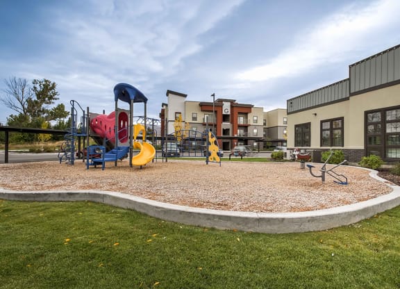 a playground at the enclave at woodbridge apartments in sugar land, tx