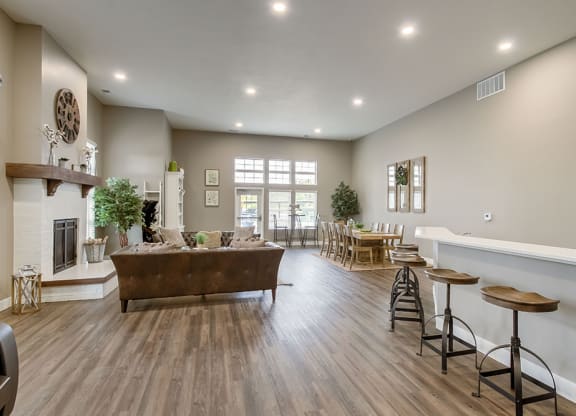 the reserve at bucklin hill leasing office resident lounge with fireplace and tv