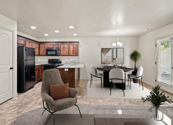 a living room and kitchen with a table and chairs