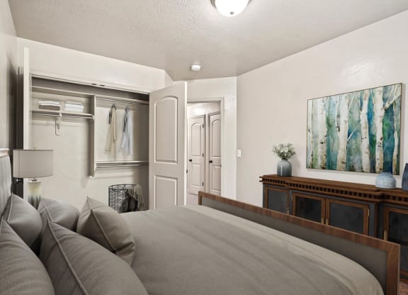a bedroom with a bed and a couch