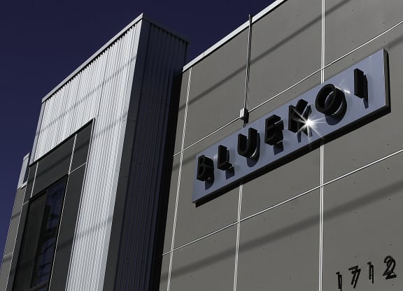 a building with a sign on the side of it at BlueKoi Townhomes for rent in Salt Lake City, UT