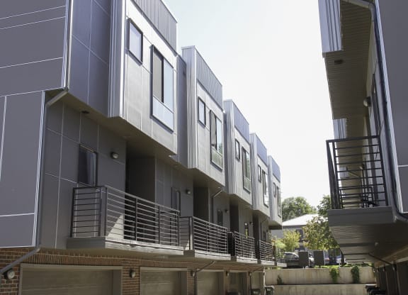 a row of modern buildings with balconies and stairs at BlueKoi Townhomes for rent in Salt Lake City, UT