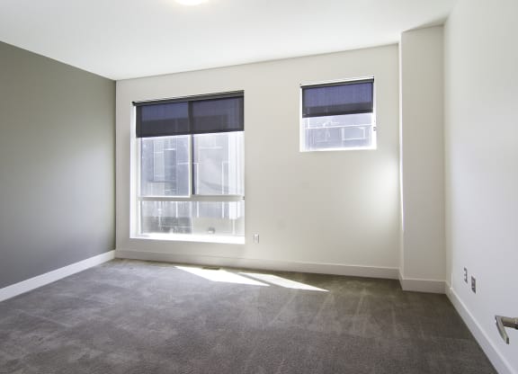 an empty room with a window and a door at BlueKoi Townhomes for rent in Salt Lake City, UT