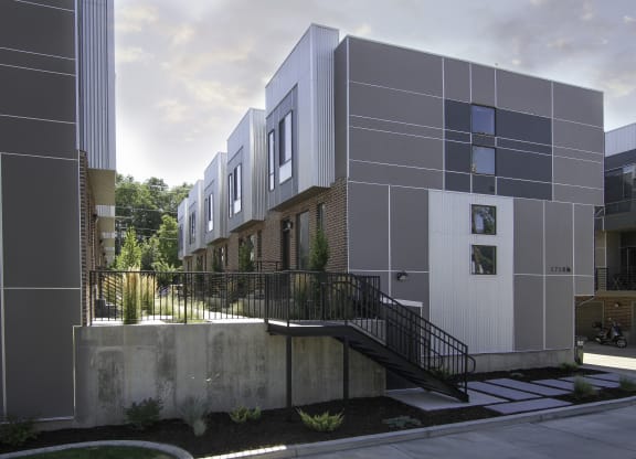 a view of a building with a staircase in front of it at BlueKoi Townhomes for rent in Salt Lake City, UT