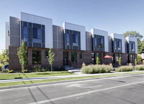 a large brick building with a street in front of it at BlueKoi Townhomes for rent in Salt Lake City, UT