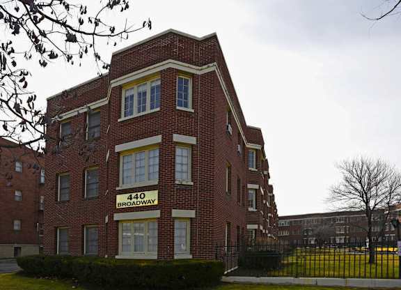 A red brick building with the number 440 on it.