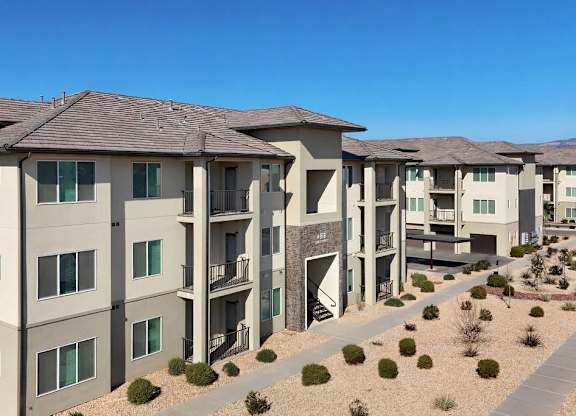 Apartment complex with a clear blue sky above.