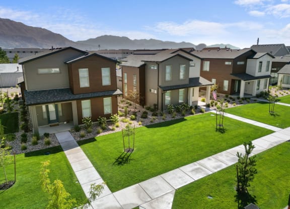 an aerial view of a neighborhood with houses and lawns
