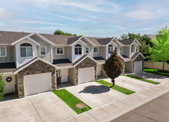 an aerial view of a row of houses with garage doors