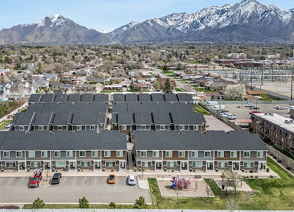 A large building with a parking lot in front of it.