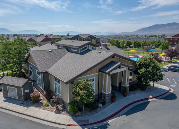 an aerial view of a home in a neighborhood with a swimming pool at Aldara Apartments in Saratoga Springs, Utah