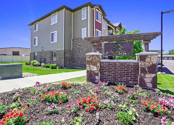 A building with a garden in front of it.