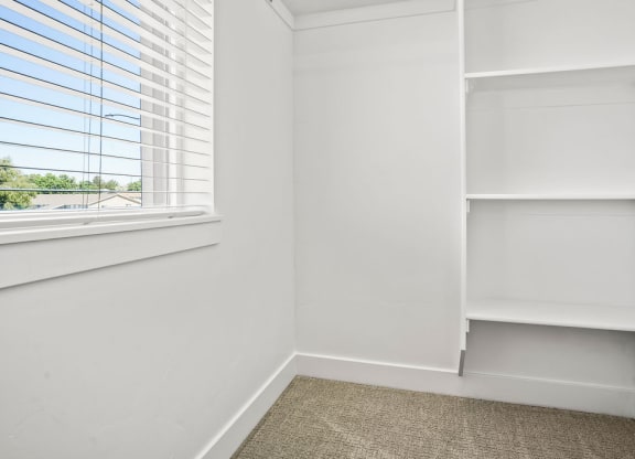 a corner of a room with a window and white shelves  at Aero Luxury Townhomes in Layton, Utah