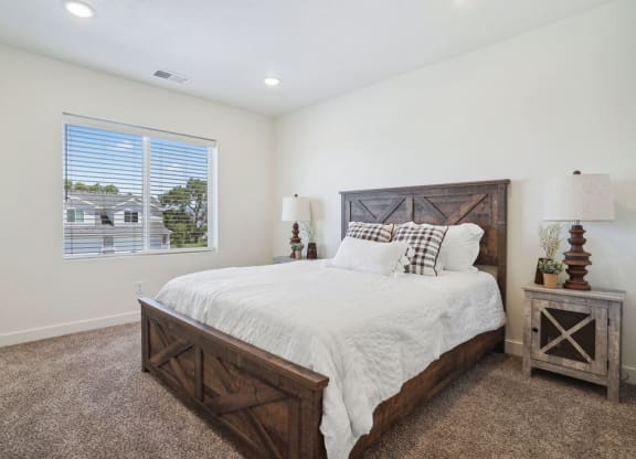 a bedroom with a bed and a window