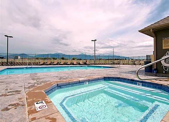 A pool with a mountain view in the background.