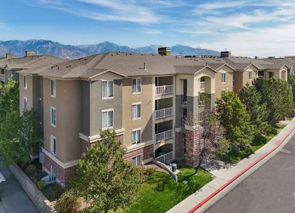 Apartment complex with a mountain range in the background.