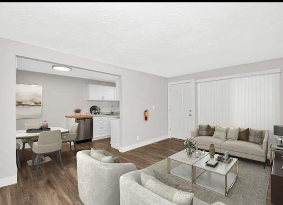 A living room with a couch, chairs, and a coffee table.