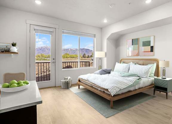A bedroom with a bed, nightstand, and a table with fruit on it.