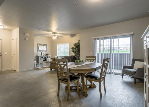 an open living room and dining room with a table and chairs