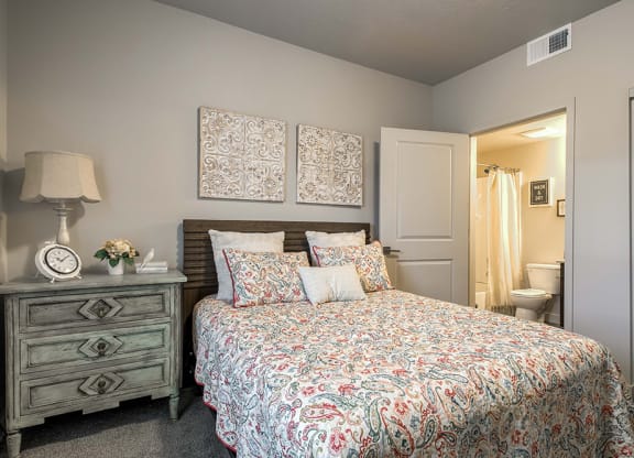 a bedroom with a bed and a nightstand