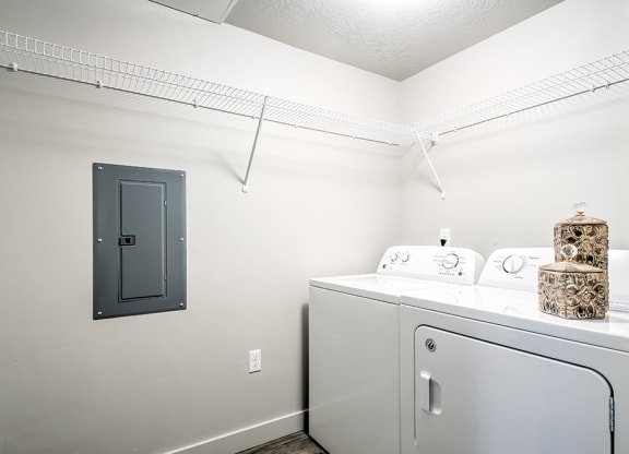 a laundry room with a washer and dryer