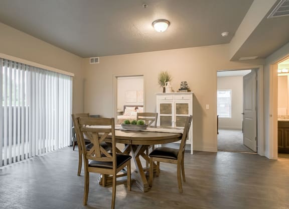a dining room with a table and chairs