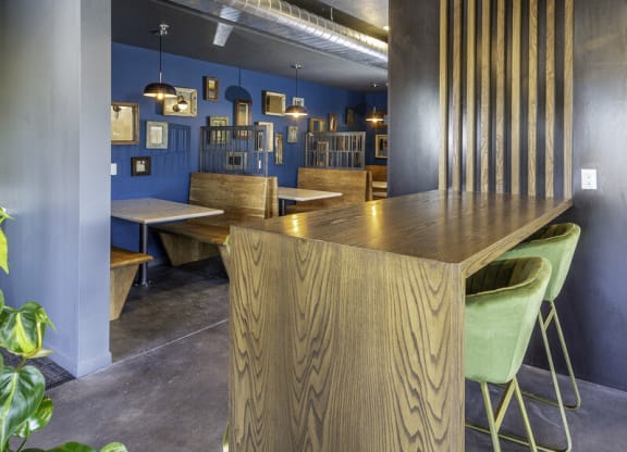 a restaurant with a wooden table and chairs