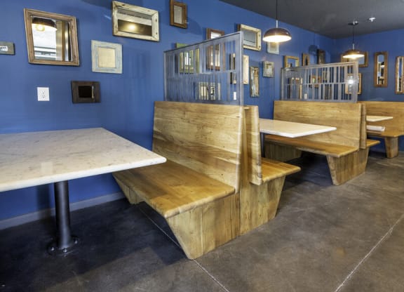 a restaurant with wooden benches and tables